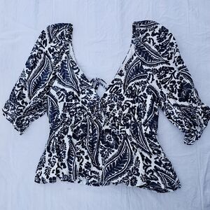Mi ami v neck black, blue, and white floral design peplum top size medium